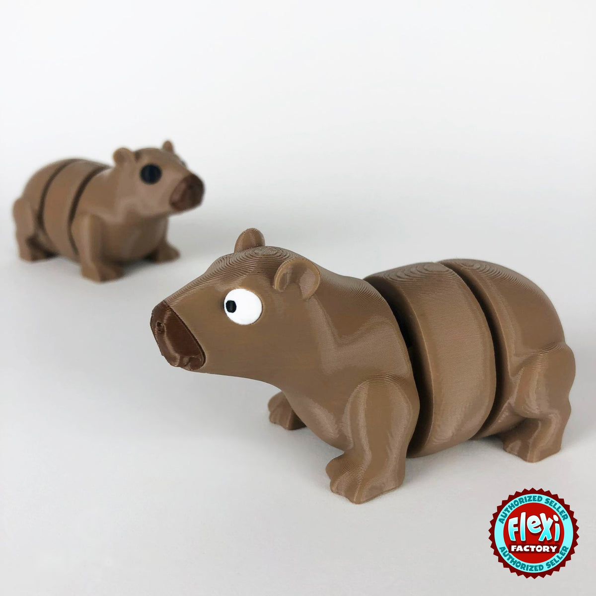 Cute capybara keychain, 3D printed by RU3D – pair of capybaras facing left. Light brown.