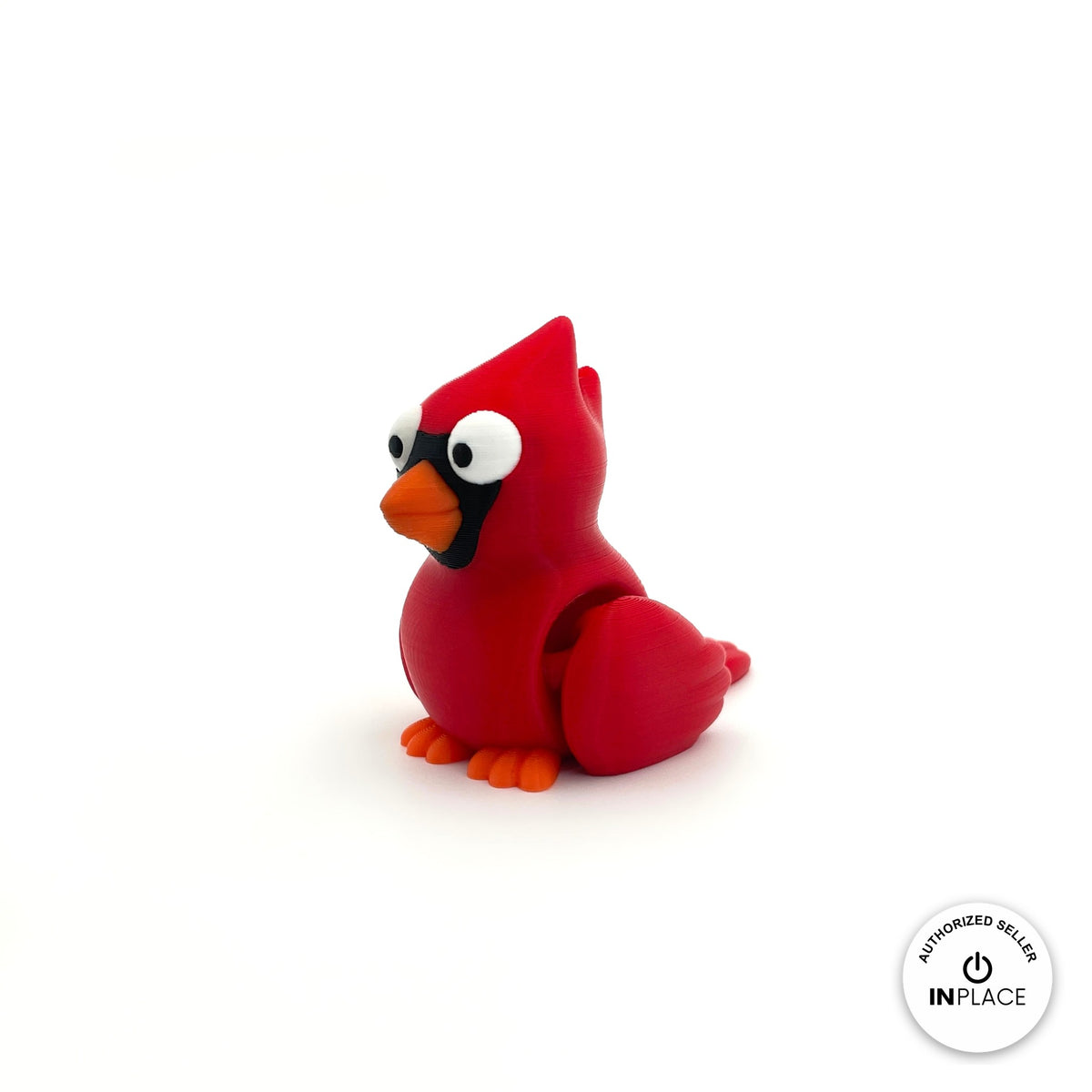 Cute cardinal bird keychain, 3D printed by RU3D – three quarter view facing left. Bright red with orange beak.