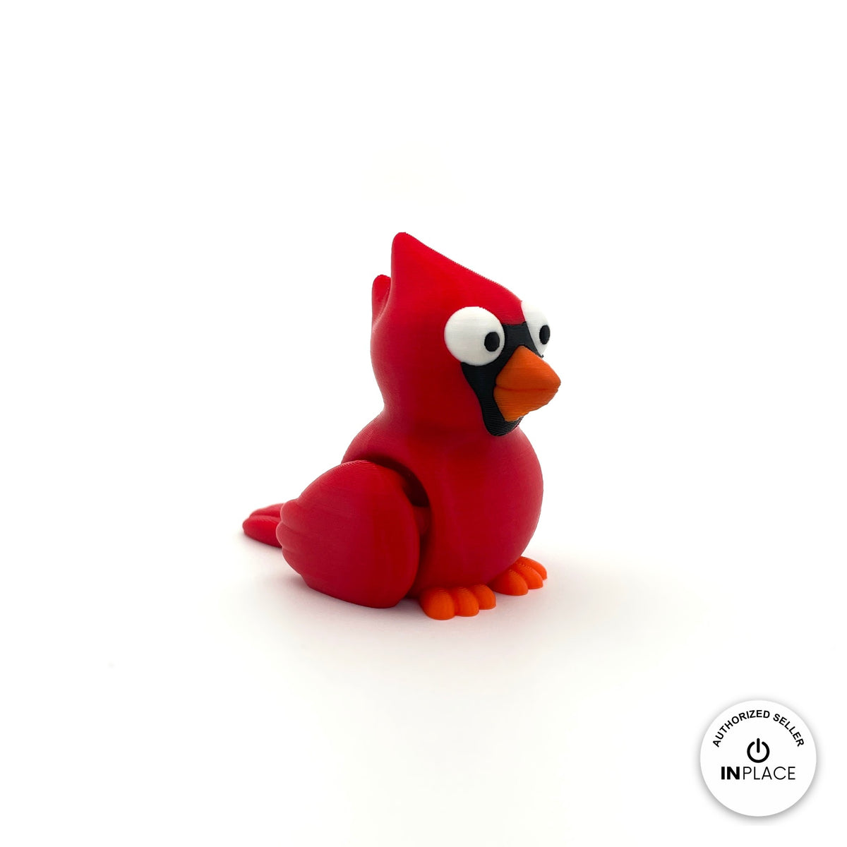 Cute cardinal bird keychain, 3D printed by RU3D – three quarter view facing right. Bright red with orange beak.