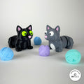 3D printed ball of wool accessory by RU3D, shown with the Cat keychain