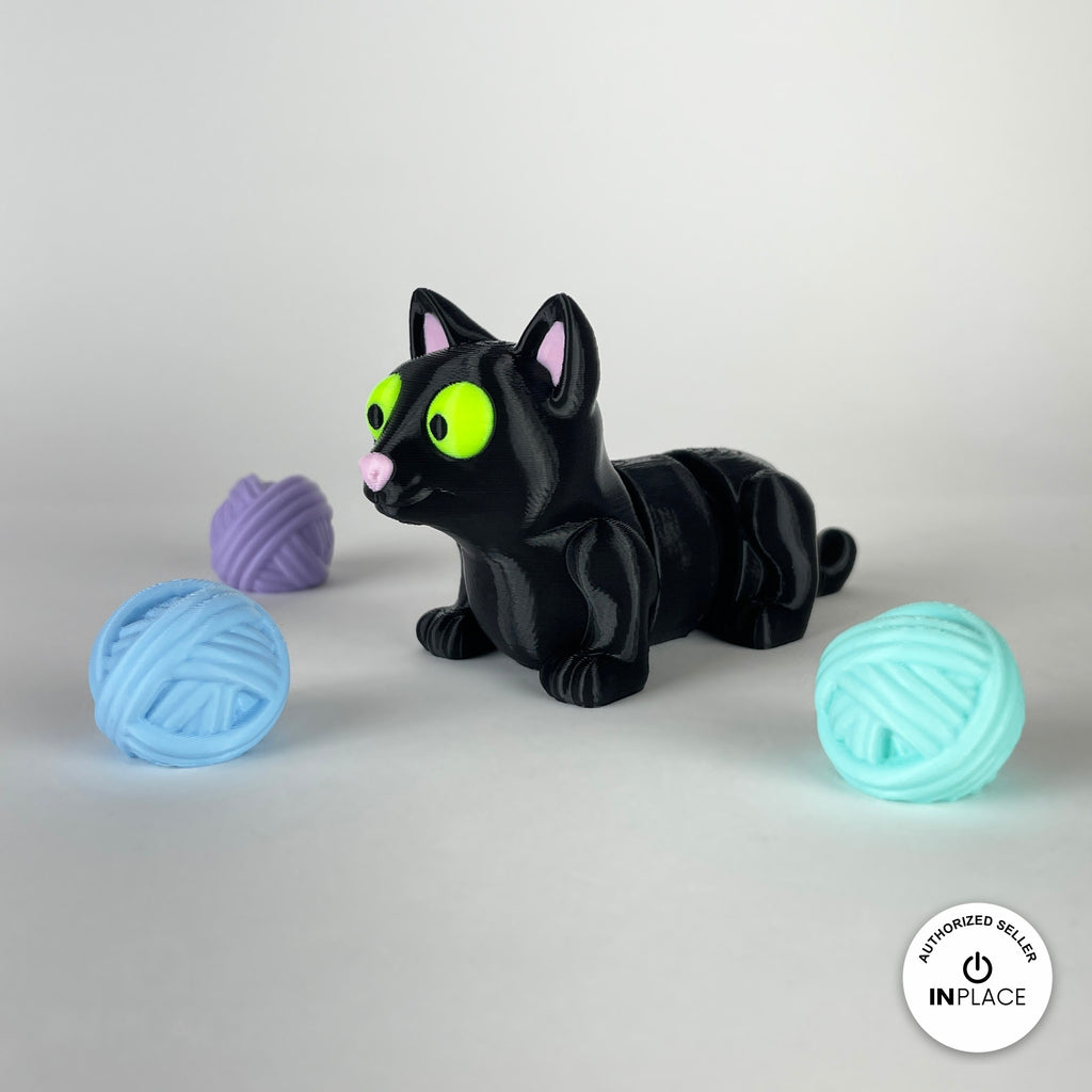 3D printed ball of wool accessory by RU3D, shown with the Cat keychain