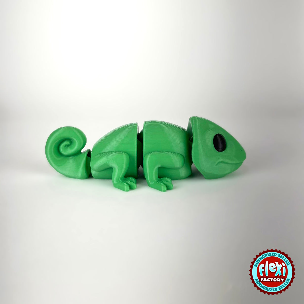 Cute chameleon keychain, 3D printed by RU3D – dark eyes profile view facing right. Bright green.
