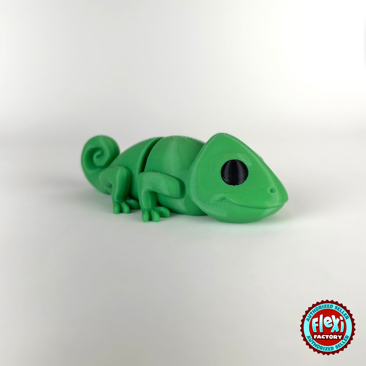 Cute chameleon keychain, 3D printed by RU3D – dark eyes side view facing right. Bright green.