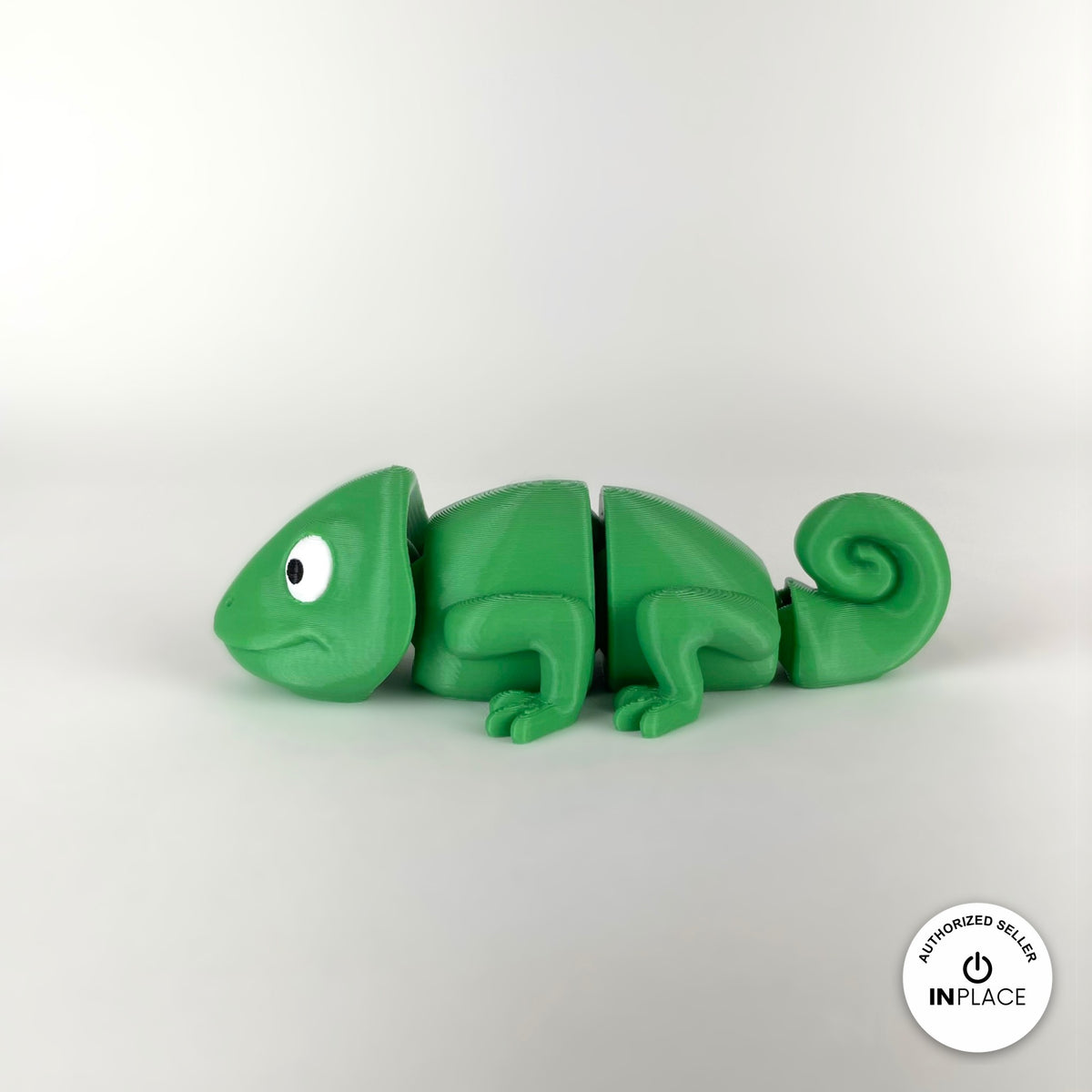 Cute chameleon keychain, 3D printed by RU3D – side view facing left. Bright green.