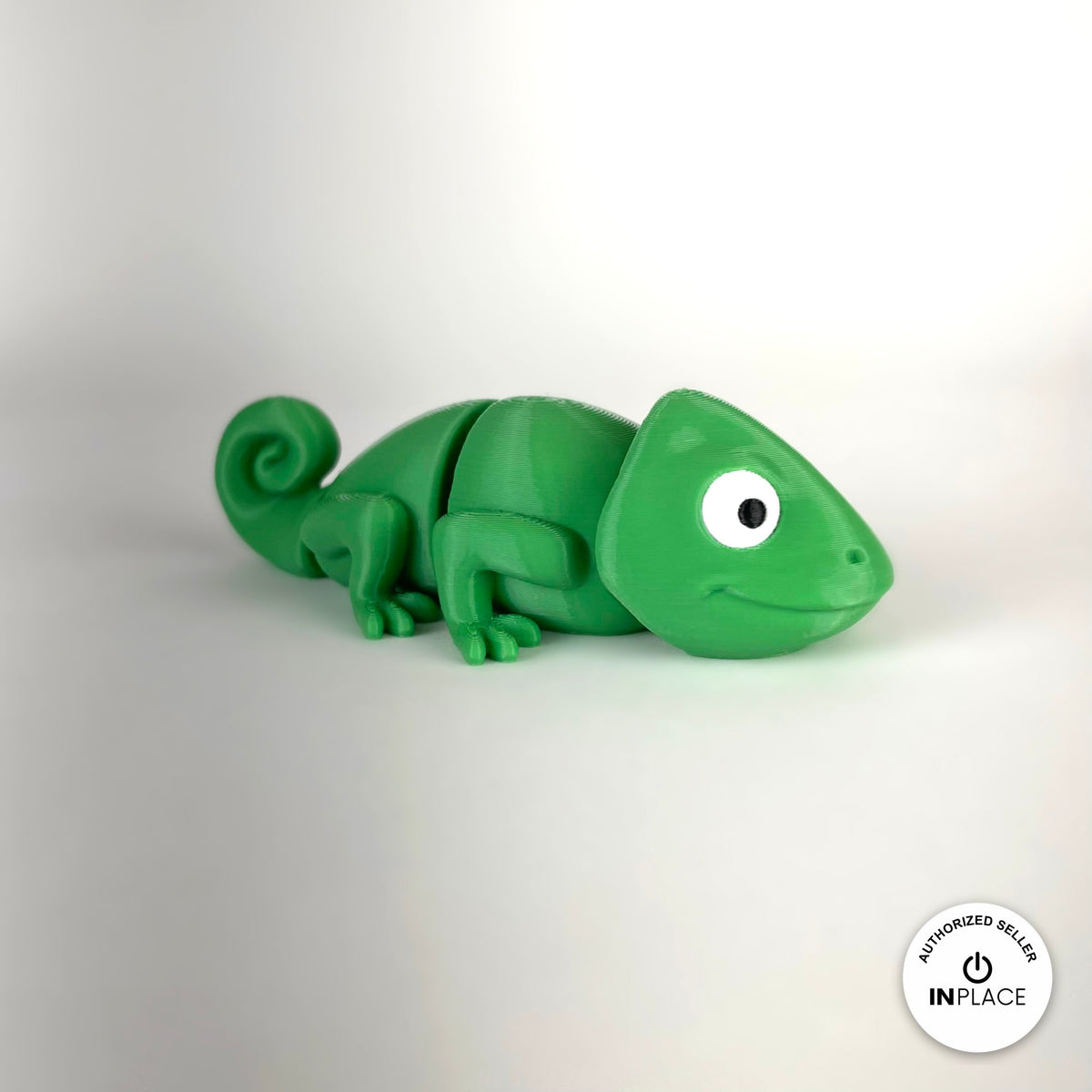 Cute chameleon keychain, 3D printed by RU3D – three quarter view facing right. Bright green.
