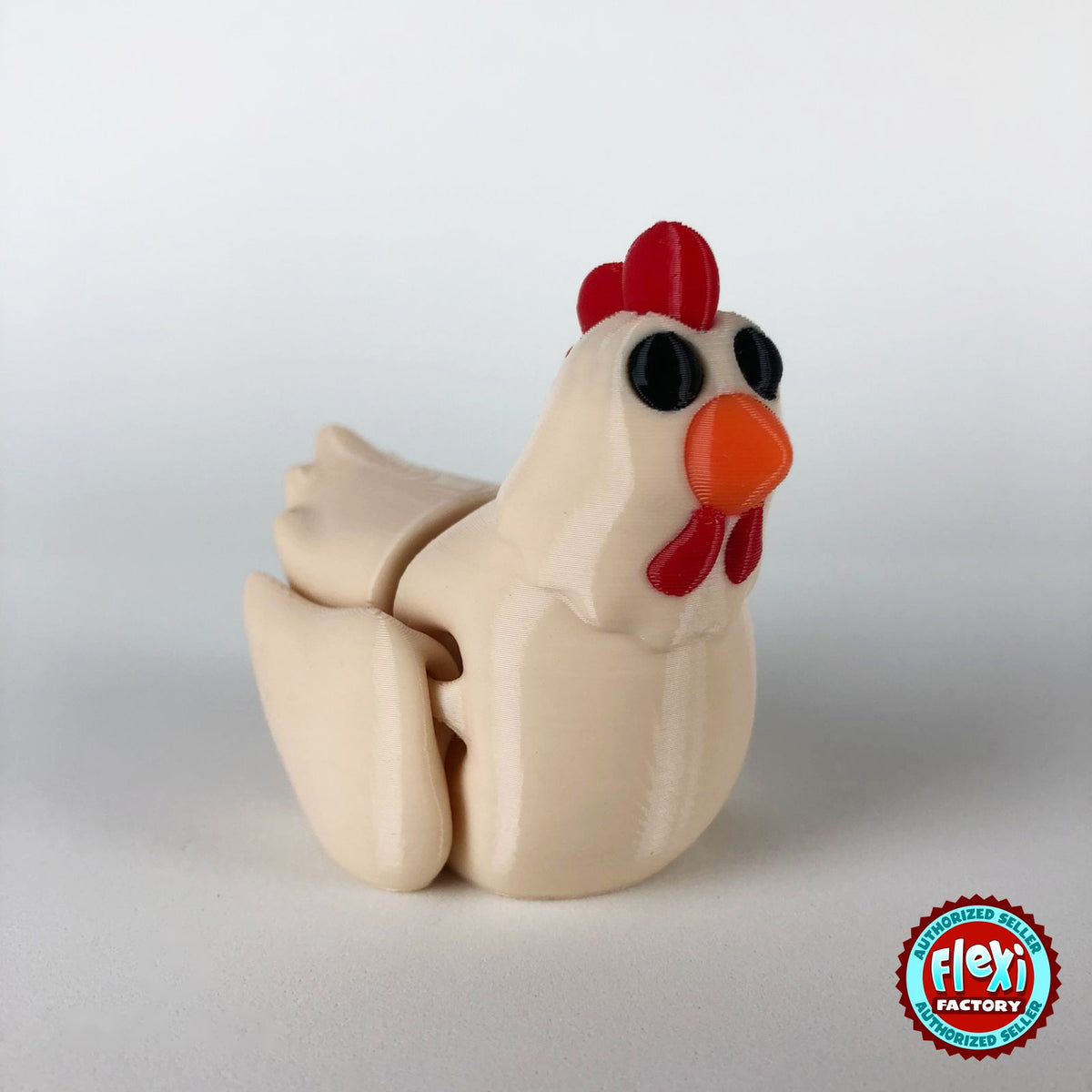 Cute chicken keychain, 3D printed by RU3D – cream hen dark eyes front view. White hen with red comb and orange beak, also in cream.