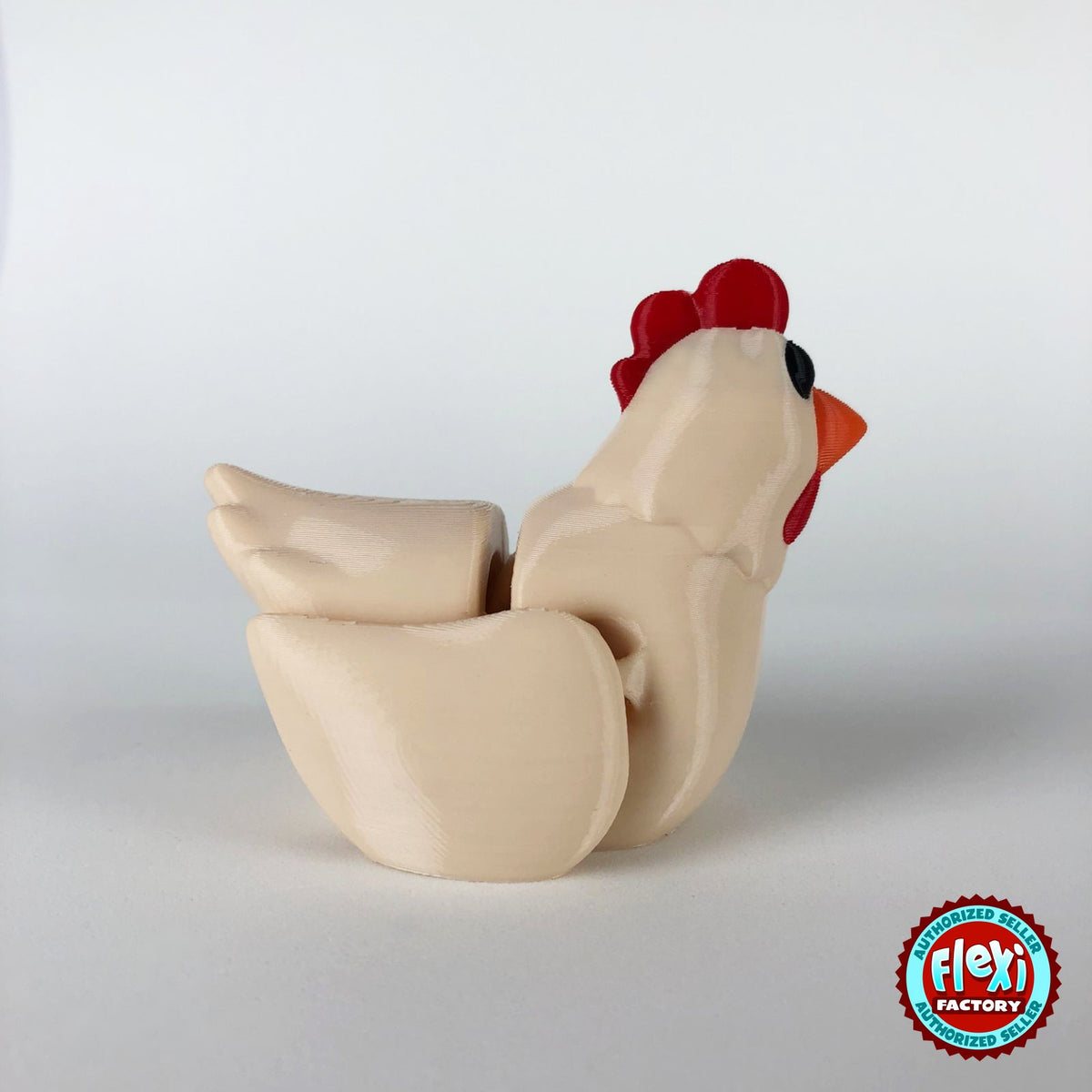 Cute chicken keychain, 3D printed by RU3D – cream hen dark eyes side view. White hen with red comb and orange beak, also in cream.