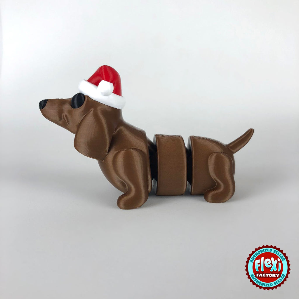 Cute Christmas dachshund keychain, 3D printed by RU3D – dark eyes side view facing left. Brown sausage dog with red Santa hat.
