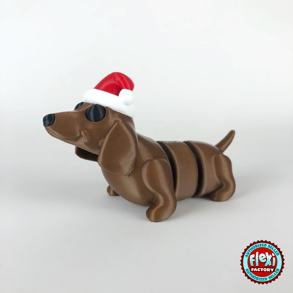 Cute Christmas dachshund keychain, 3D printed by RU3D – dark eyes three quarter view facing left. Brown sausage dog with red Santa hat.