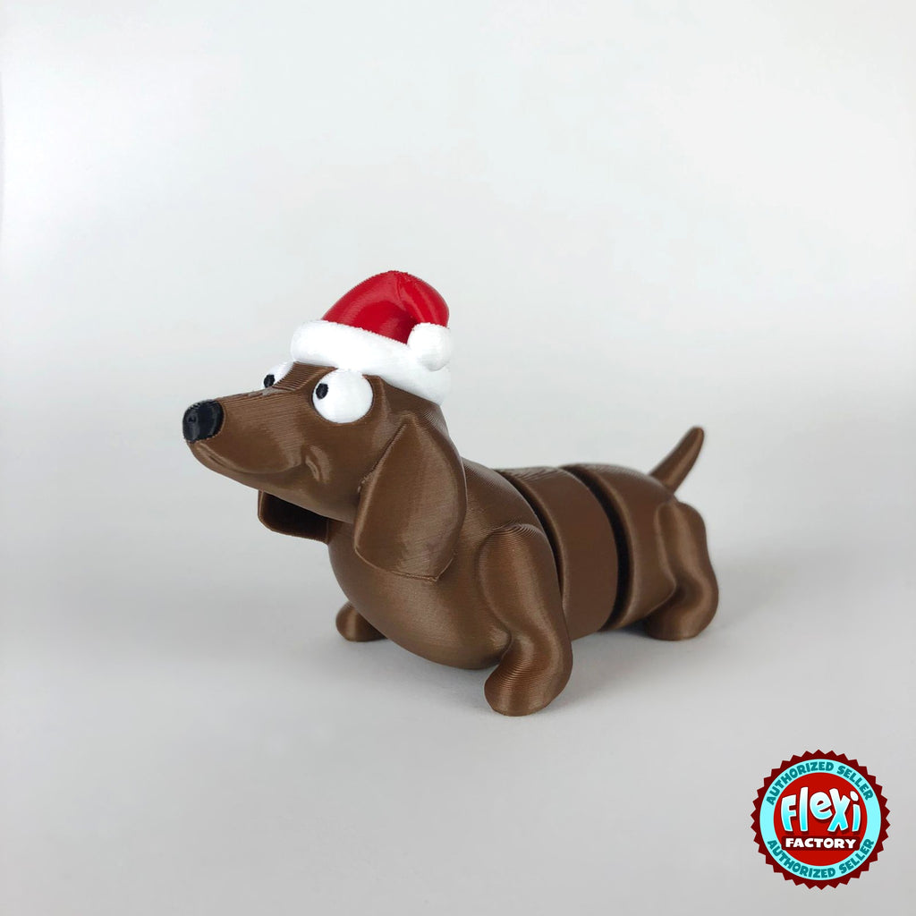 Cute Christmas dachshund keychain, 3D printed by RU3D – three quarter view facing left. Brown sausage dog with red Santa hat.