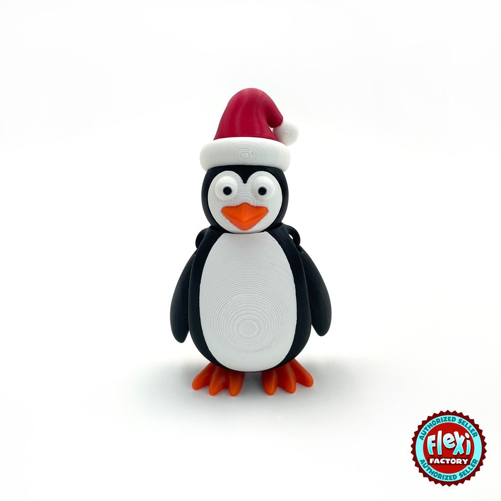 Cute Christmas penguin keychain, 3D printed by RU3D – front view. Black and white with red Santa hat and orange feet.