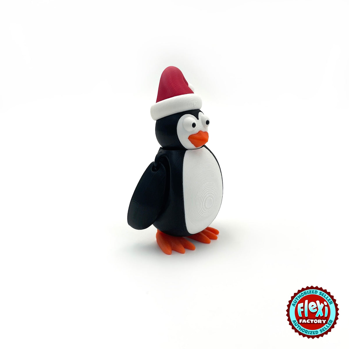 Cute Christmas penguin keychain, 3D printed by RU3D – side view facing right. Black and white with red Santa hat and orange feet.