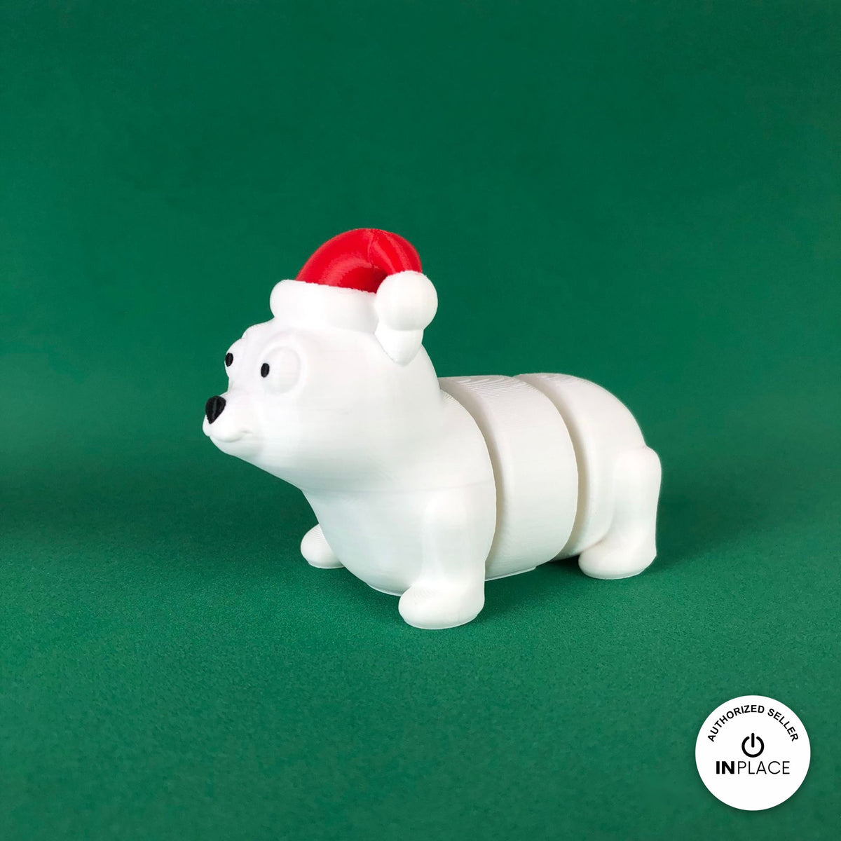 Cute Christmas polar bear keychain, 3D printed by RU3D – three quarter view facing left. White with red Santa hat.