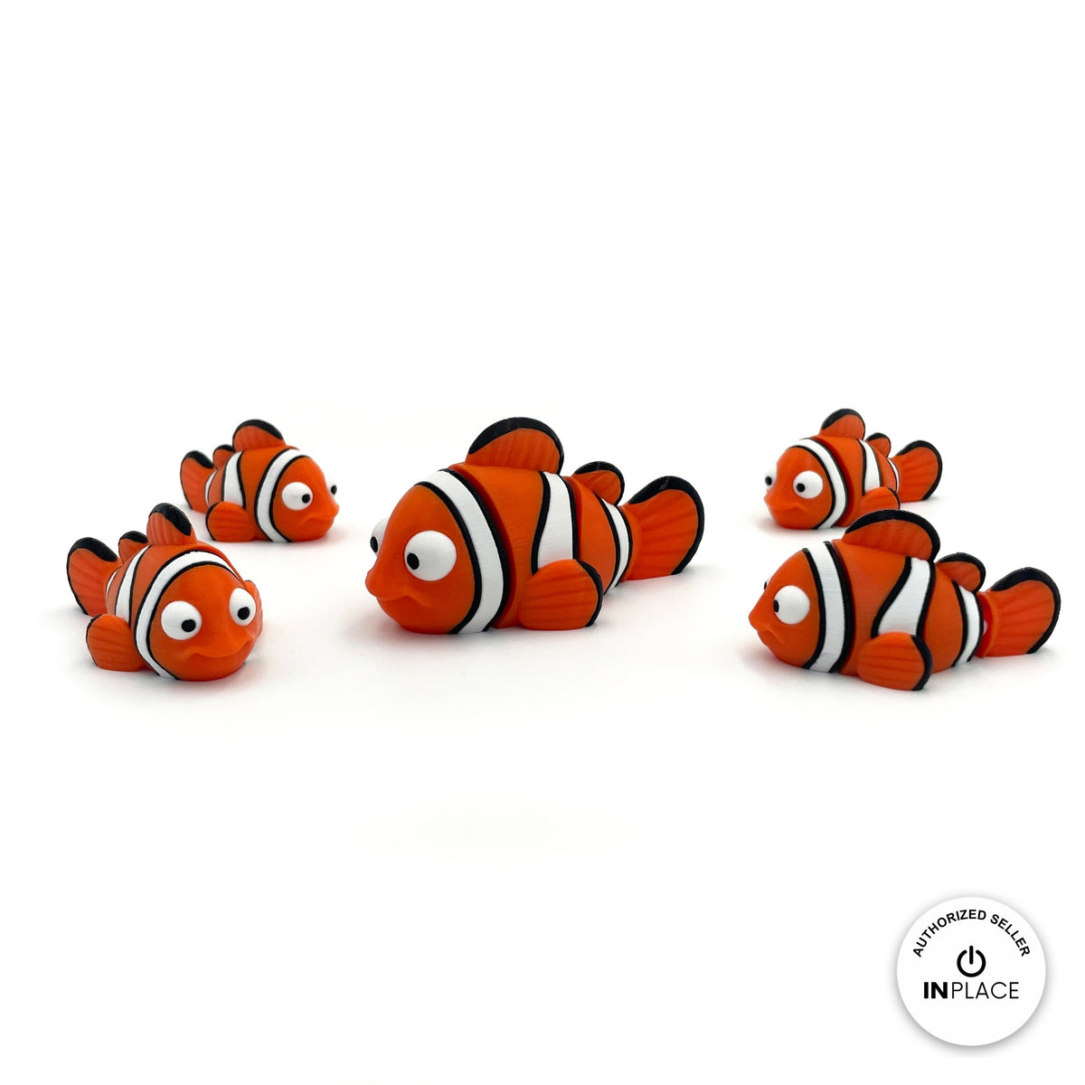 Cute clownfish keychain, 3D printed by RU3D – group of clownfish. Orange with white and black stripes.