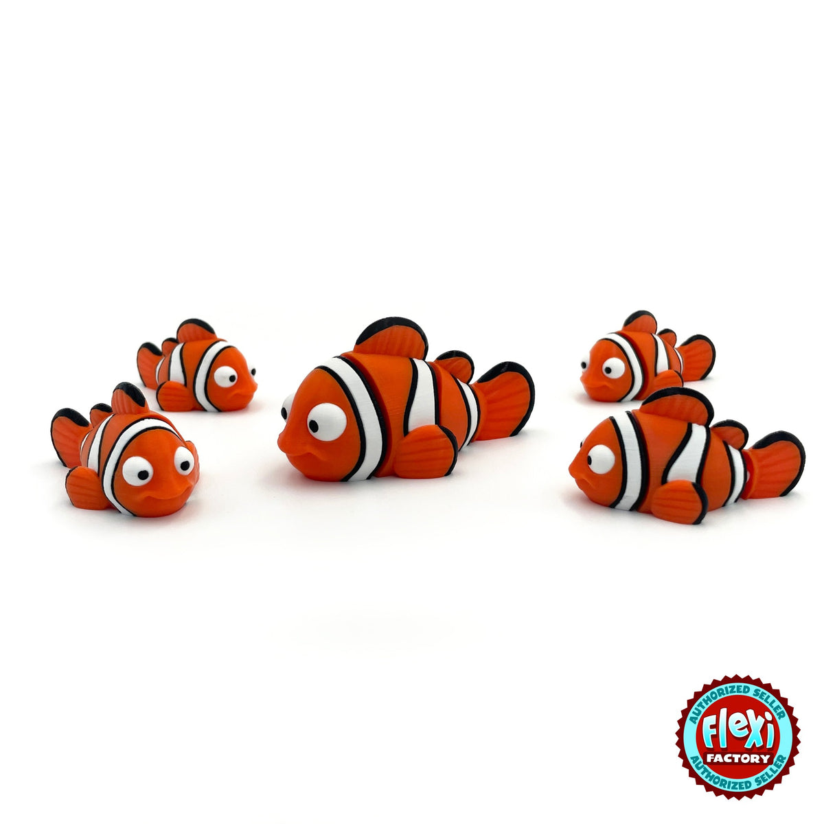 Cute clownfish keychain, 3D printed by RU3D – group of clownfish. Orange with white and black stripes.