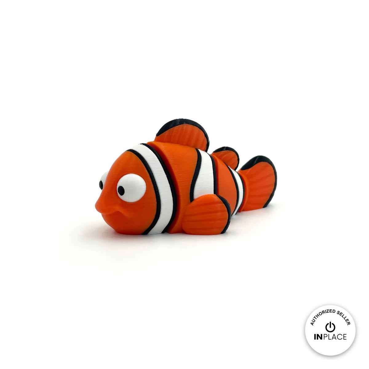 Cute clownfish keychain, 3D printed by RU3D – three quarter view facing left. Orange with white and black stripes.