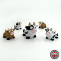 Cute cow keychain, 3D printed by RU3D – group of cows. Black and white dairy cow with pink nose.