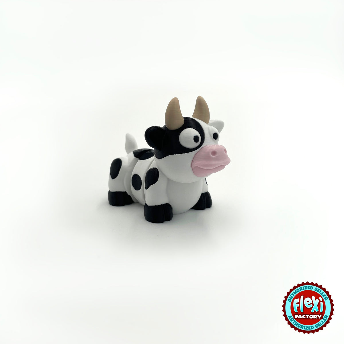 Cute cow keychain, 3D printed by RU3D – three quarter view facing right. Black and white dairy cow with pink nose.