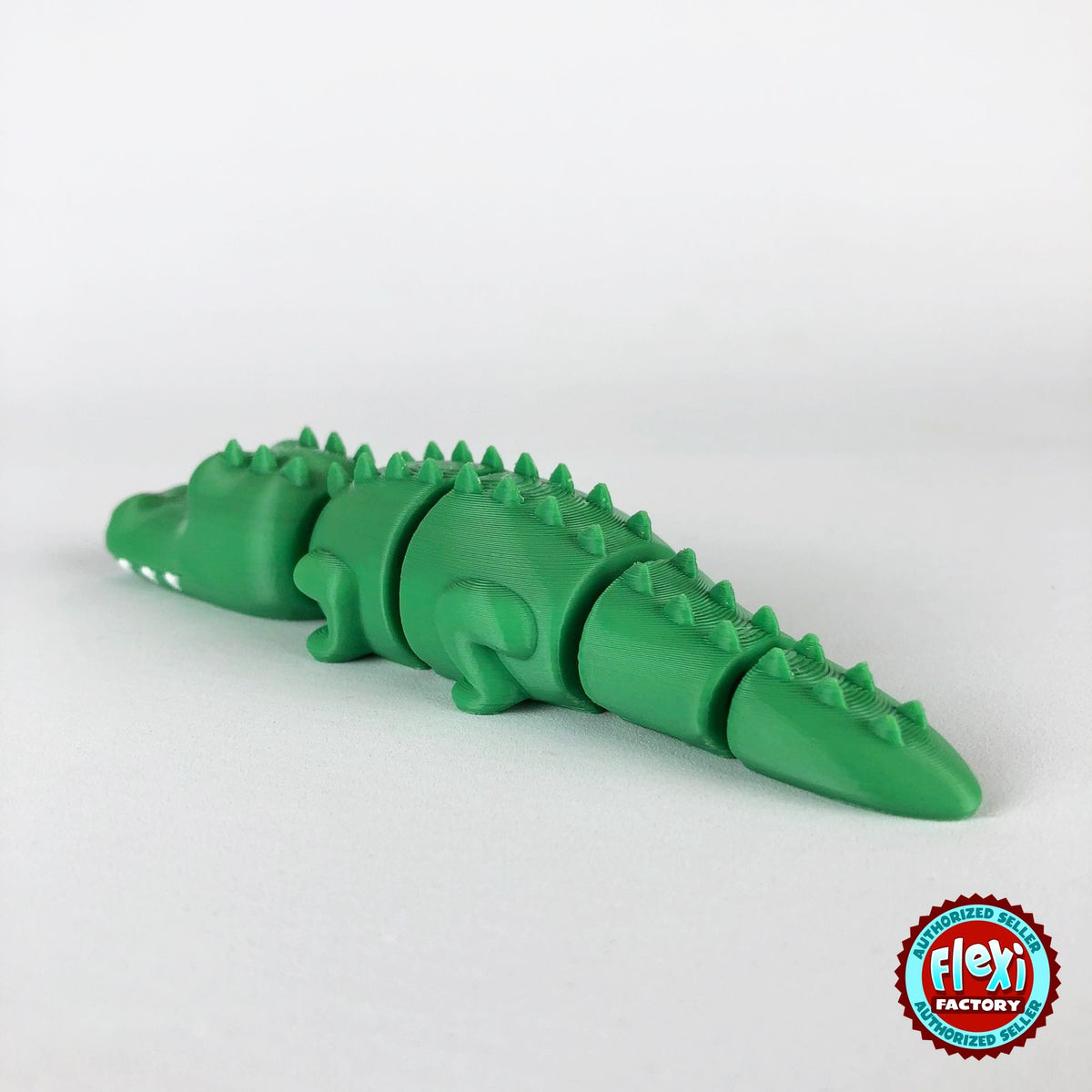 Cute crocodile keychain, 3D printed by RU3D – rear three quarter view. Green with white teeth.