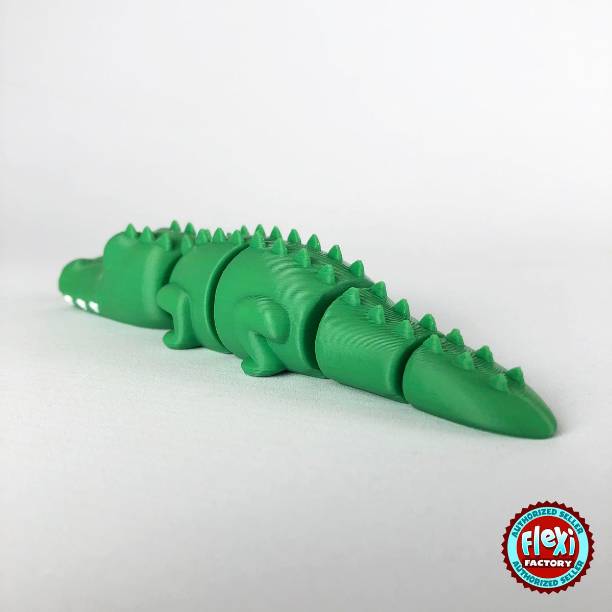 Cute crocodile keychain, 3D printed by RU3D – rear view facing left. Green with white teeth.