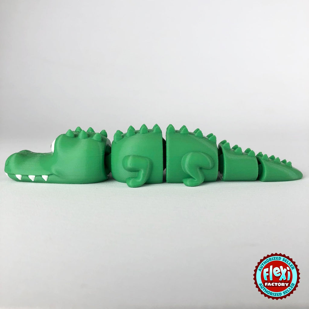 Cute crocodile keychain, 3D printed by RU3D – side view facing left tail right. Green with white teeth.