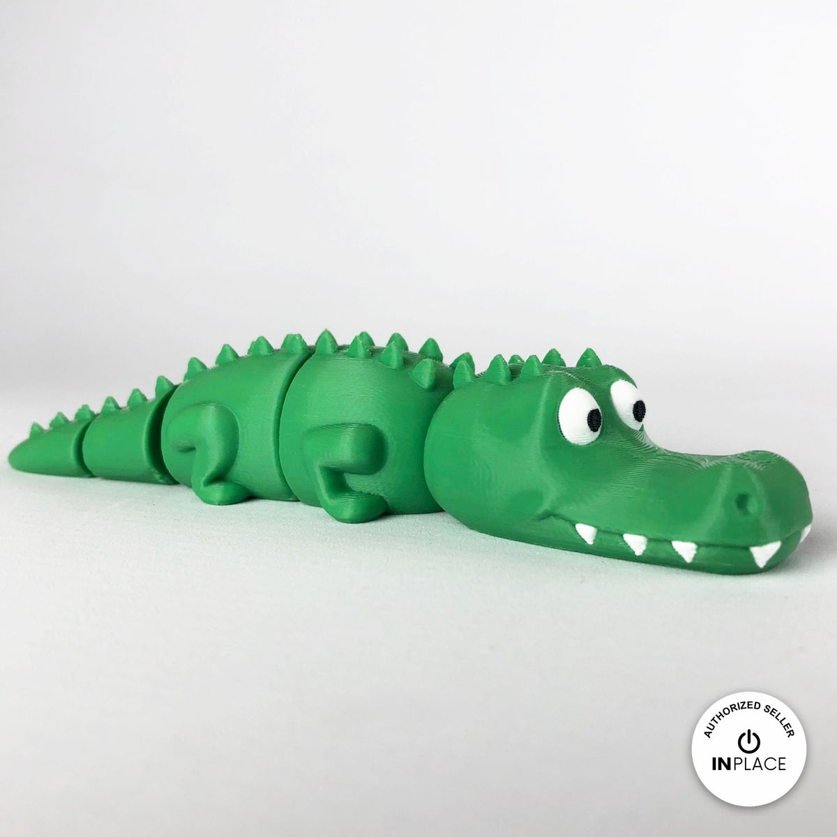 Cute crocodile keychain, 3D printed by RU3D – side view facing right. Green with white teeth.