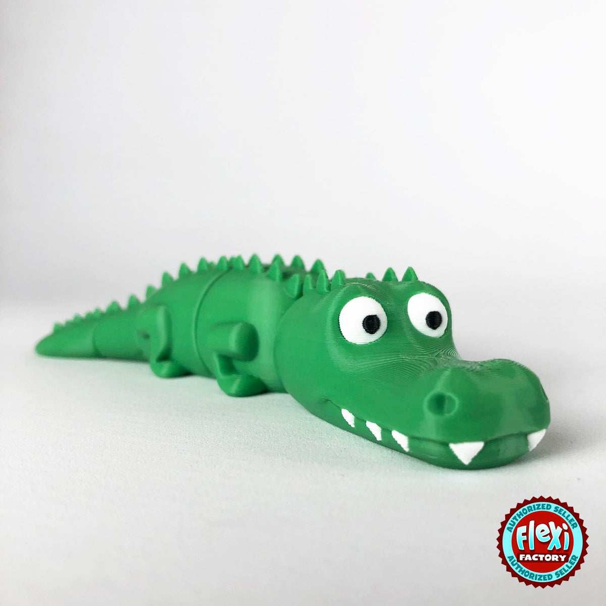 Cute crocodile keychain, 3D printed by RU3D – three quarter view facing right. Green with white teeth.