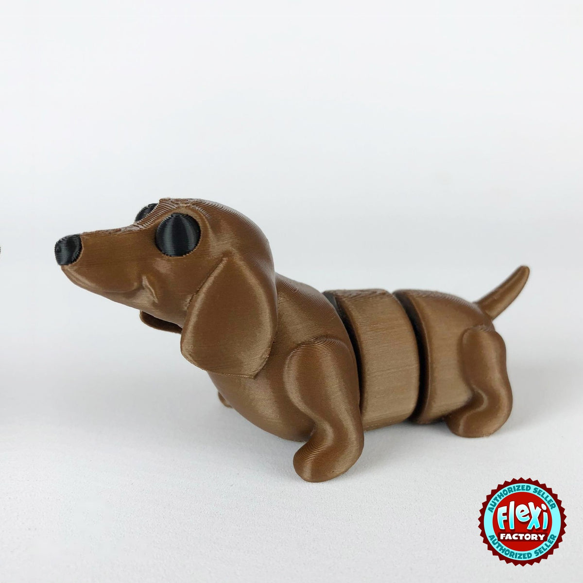 Cute dachshund sausage dog keychain, 3D printed by RU3D – dark eyes three quarter view facing left. Brown.