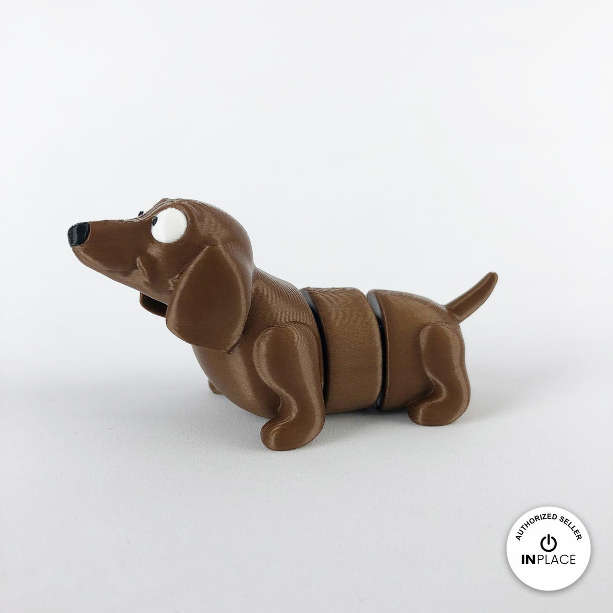 Cute dachshund sausage dog keychain, 3D printed by RU3D – three quarter view facing left. Brown.