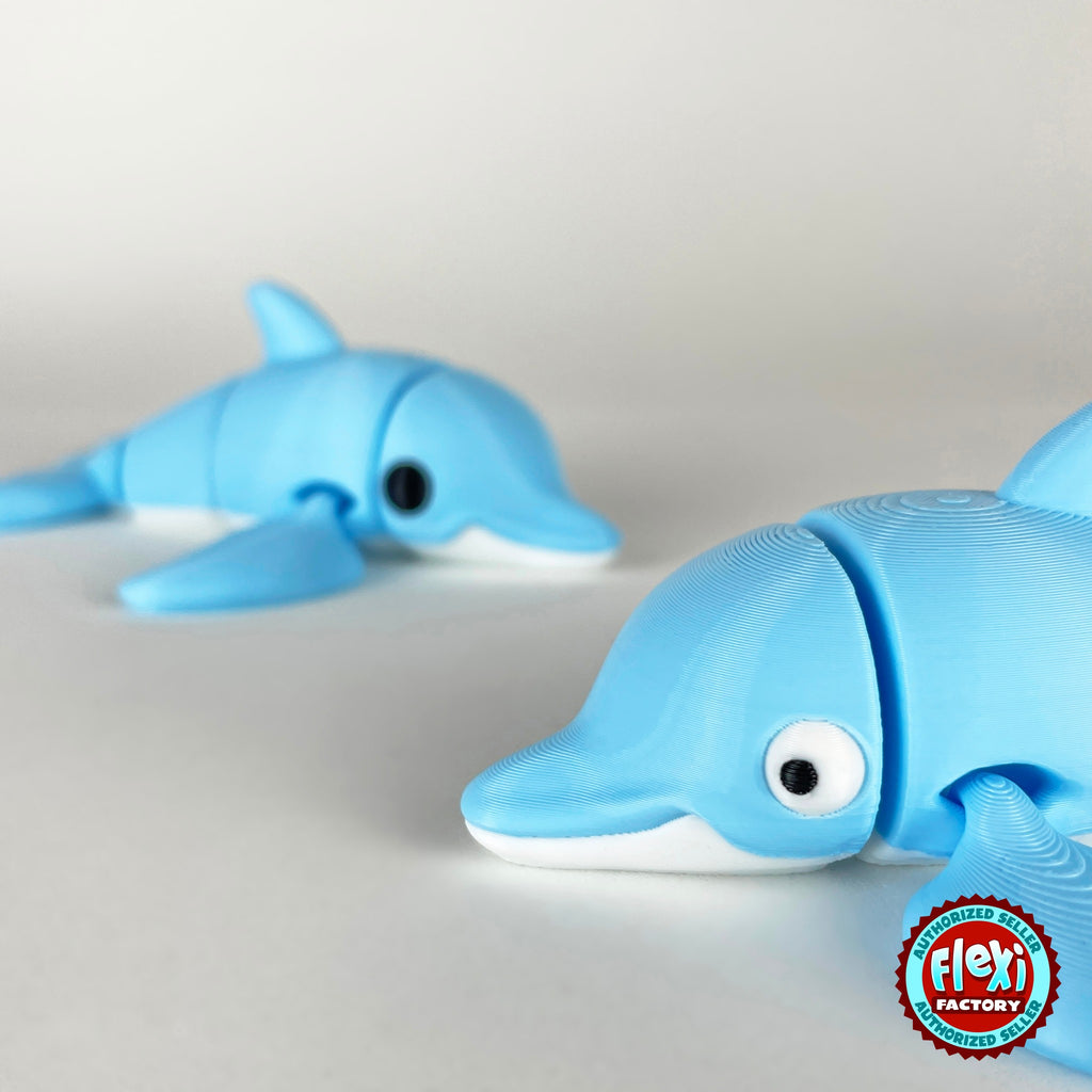 Cute dolphin keychain, 3D printed by RU3D – close up face with dolphin behind. Sky blue with white belly.