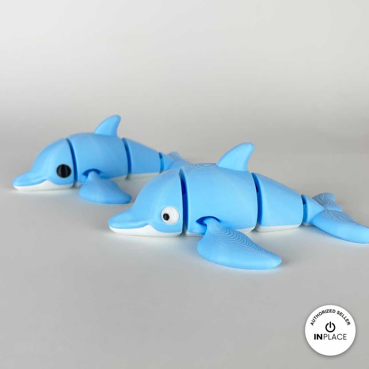 Cute dolphin keychain, 3D printed by RU3D – pair of dolphins. Sky blue with white belly.