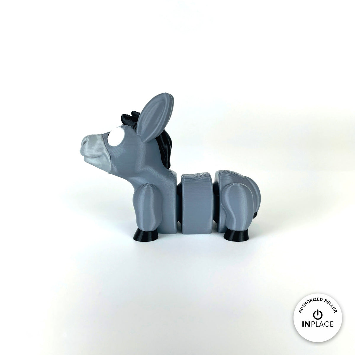 Cute donkey keychain, 3D printed by RU3D – side view facing left. Grey with black mane and hooves.