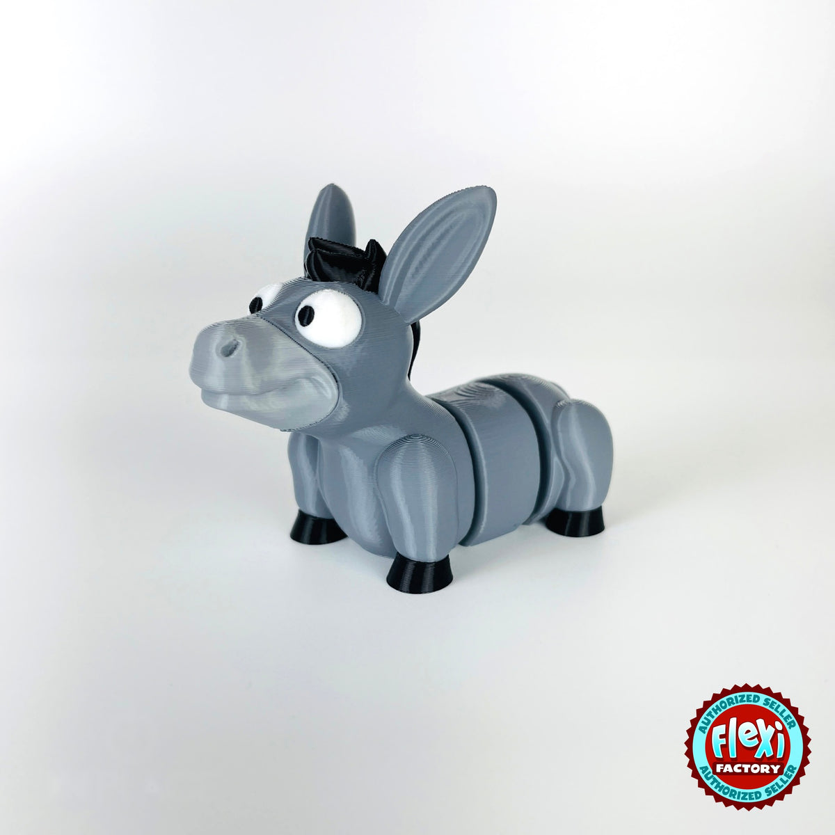 Cute donkey keychain, 3D printed by RU3D – three quarter view facing left. Grey with black mane and hooves.