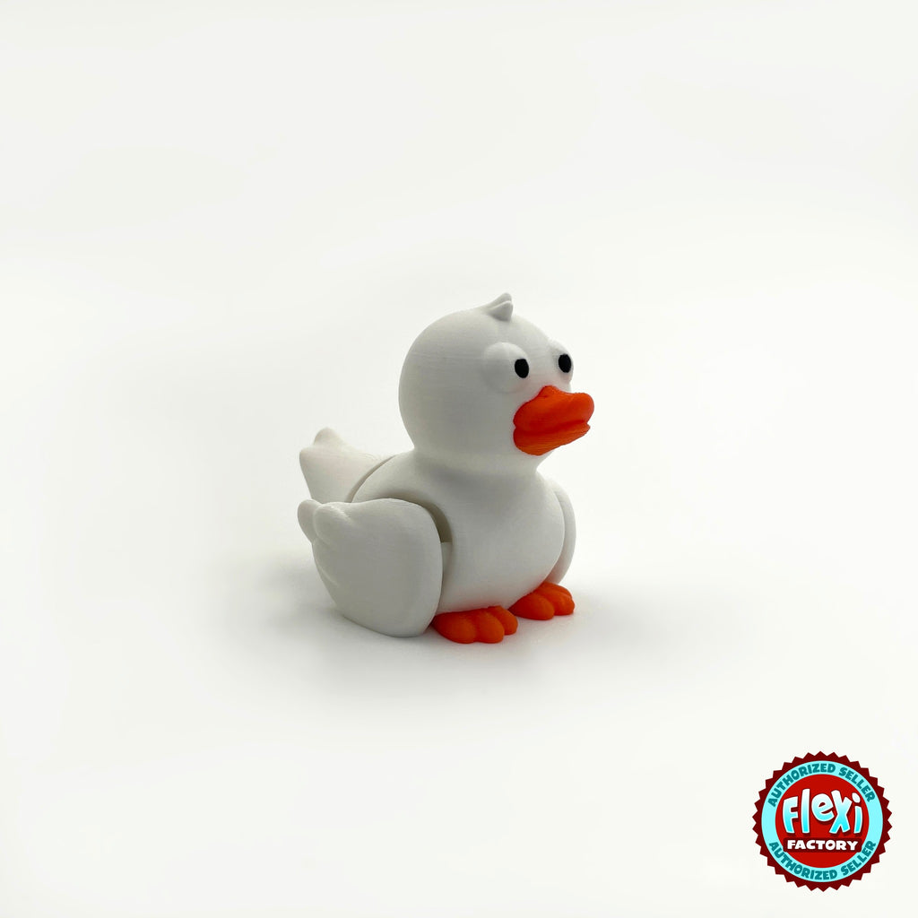 Cute duck keychain, 3D printed by RU3D – white duck three quarter view facing right. Yellow with orange beak, also in white.