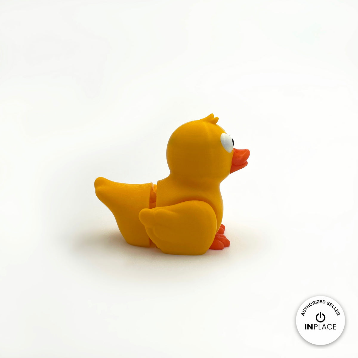 Cute duck keychain, 3D printed by RU3D – yellow duck side view facing right. Yellow with orange beak, also in white.