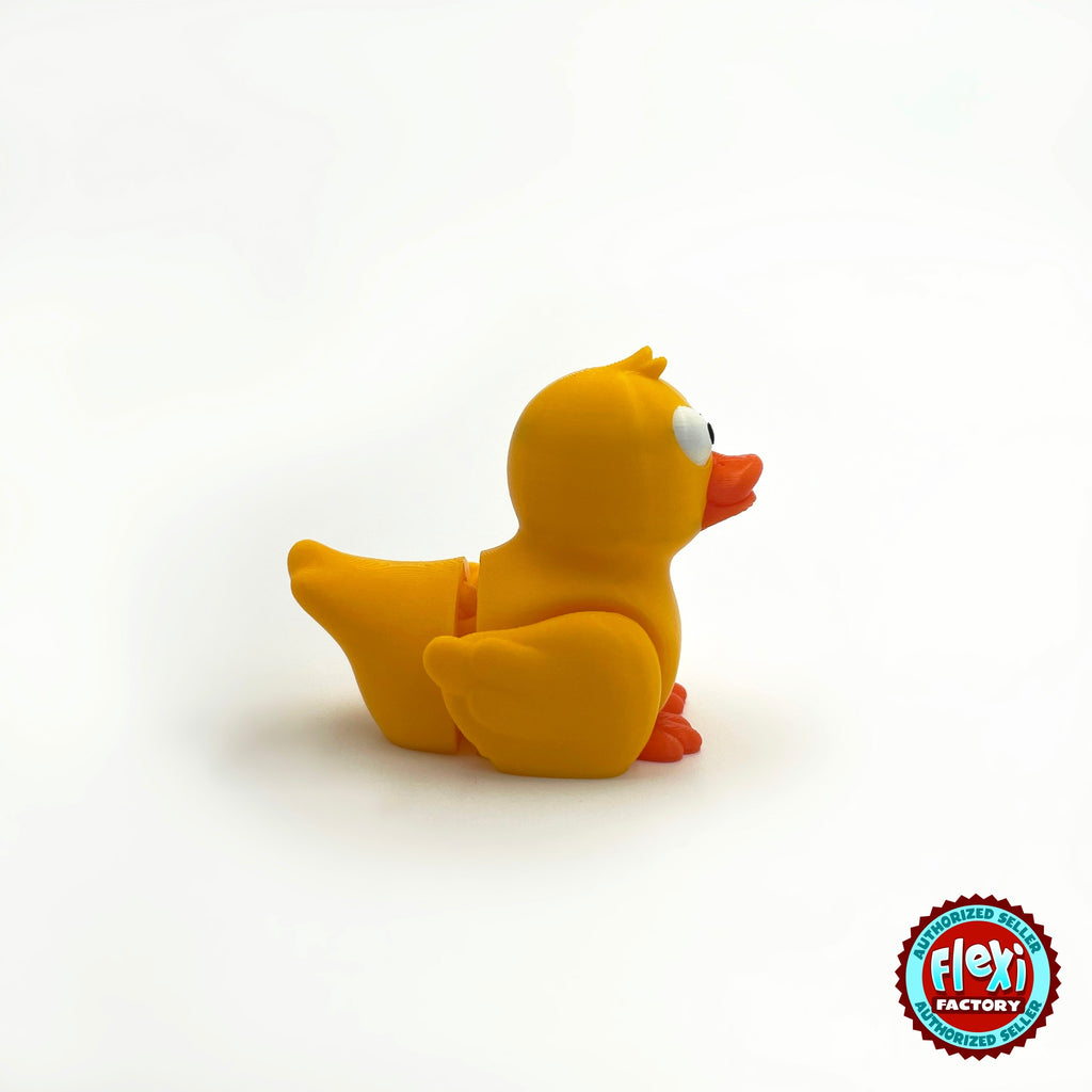 Cute duck keychain, 3D printed by RU3D – yellow duck side view facing right. Yellow with orange beak, also in white.
