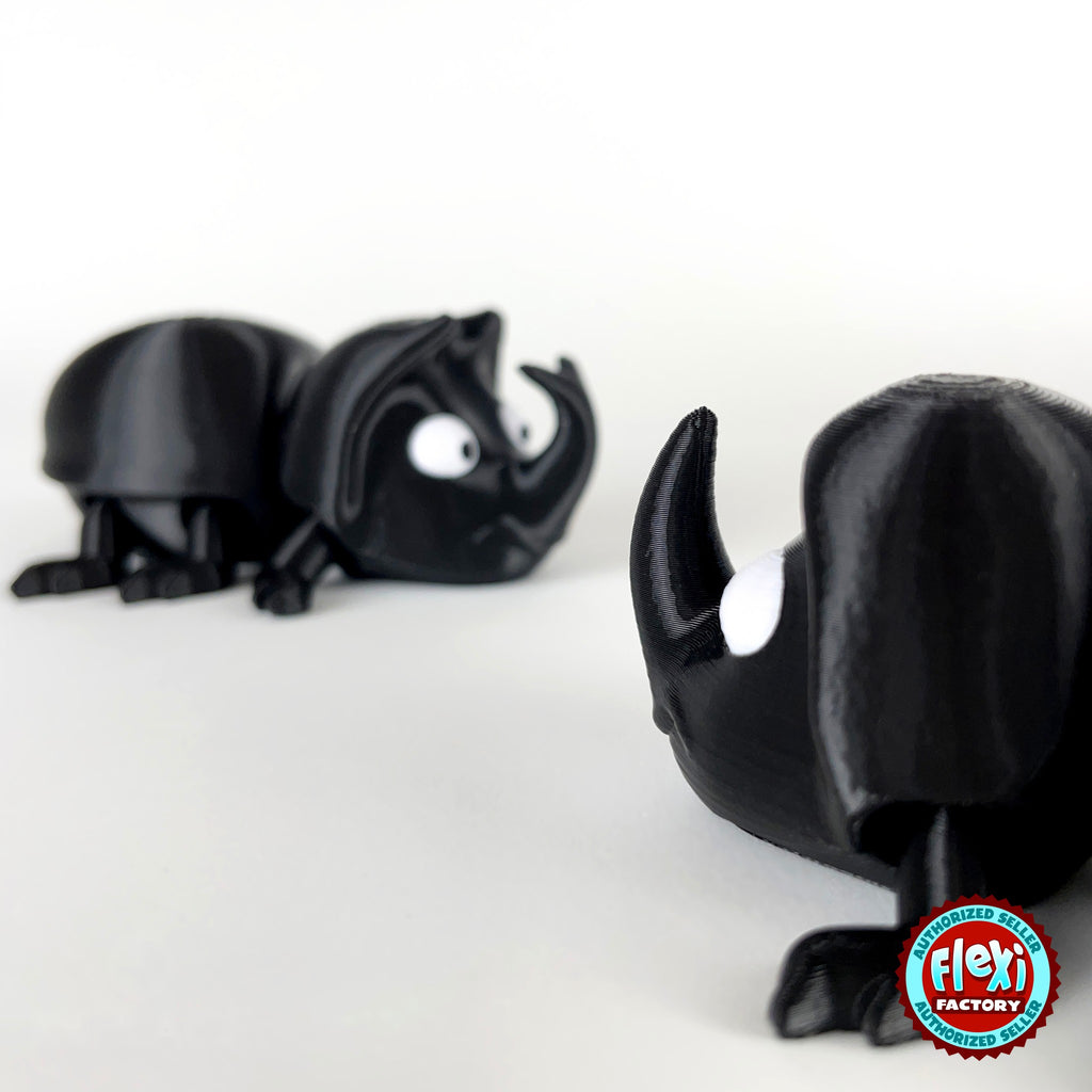 Cute dung beetle keychain, 3D printed by RU3D – close up horn with beetle behind. Black rhino beetle with brown dung ball.