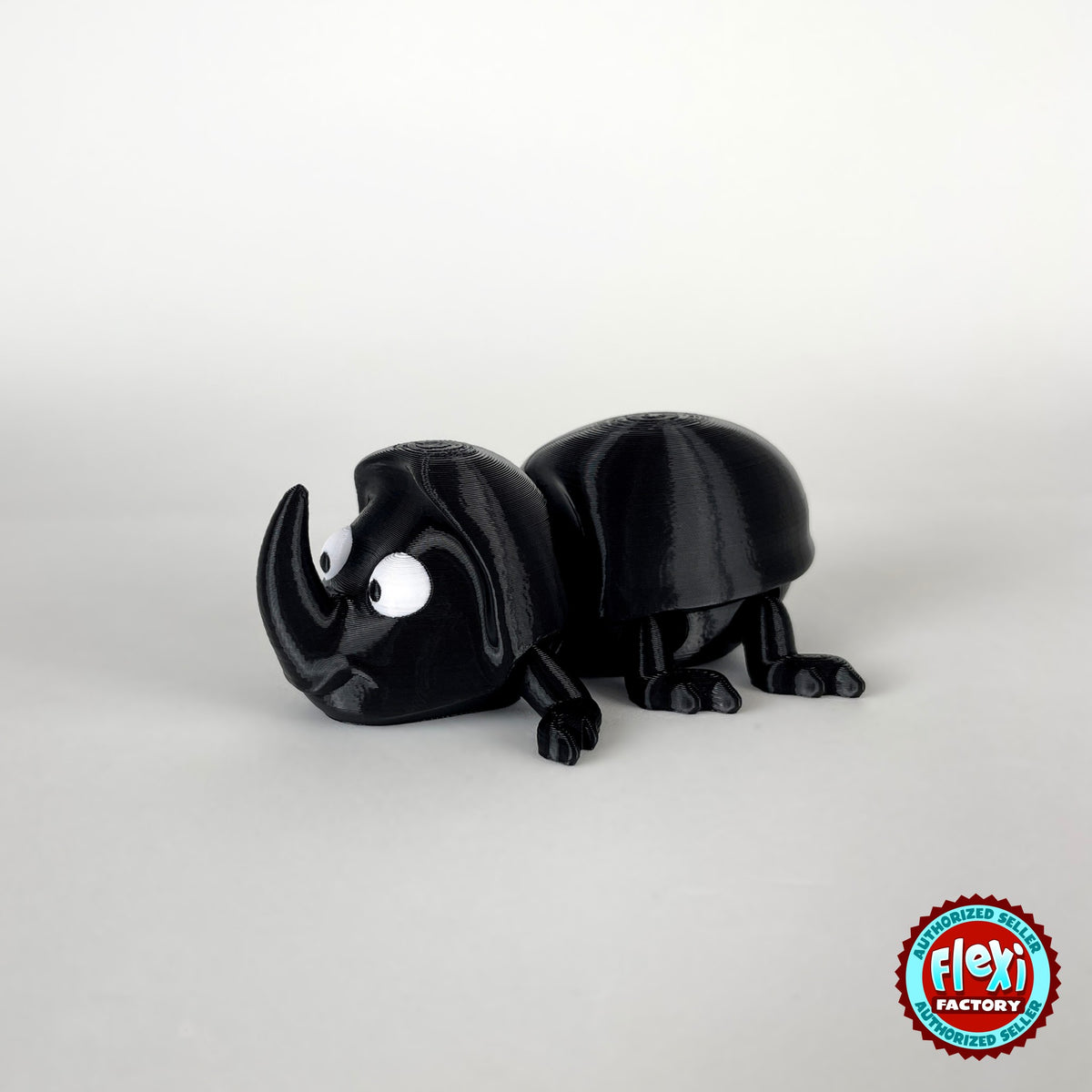 Cute dung beetle keychain, 3D printed by RU3D – side view facing left. Black rhino beetle with brown dung ball.