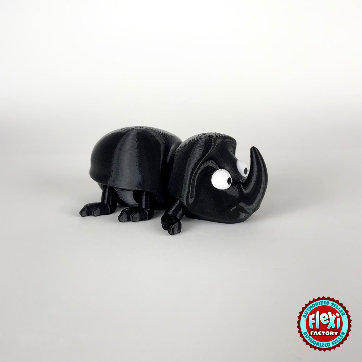 Cute dung beetle keychain, 3D printed by RU3D – side view facing right. Black rhino beetle with brown dung ball.