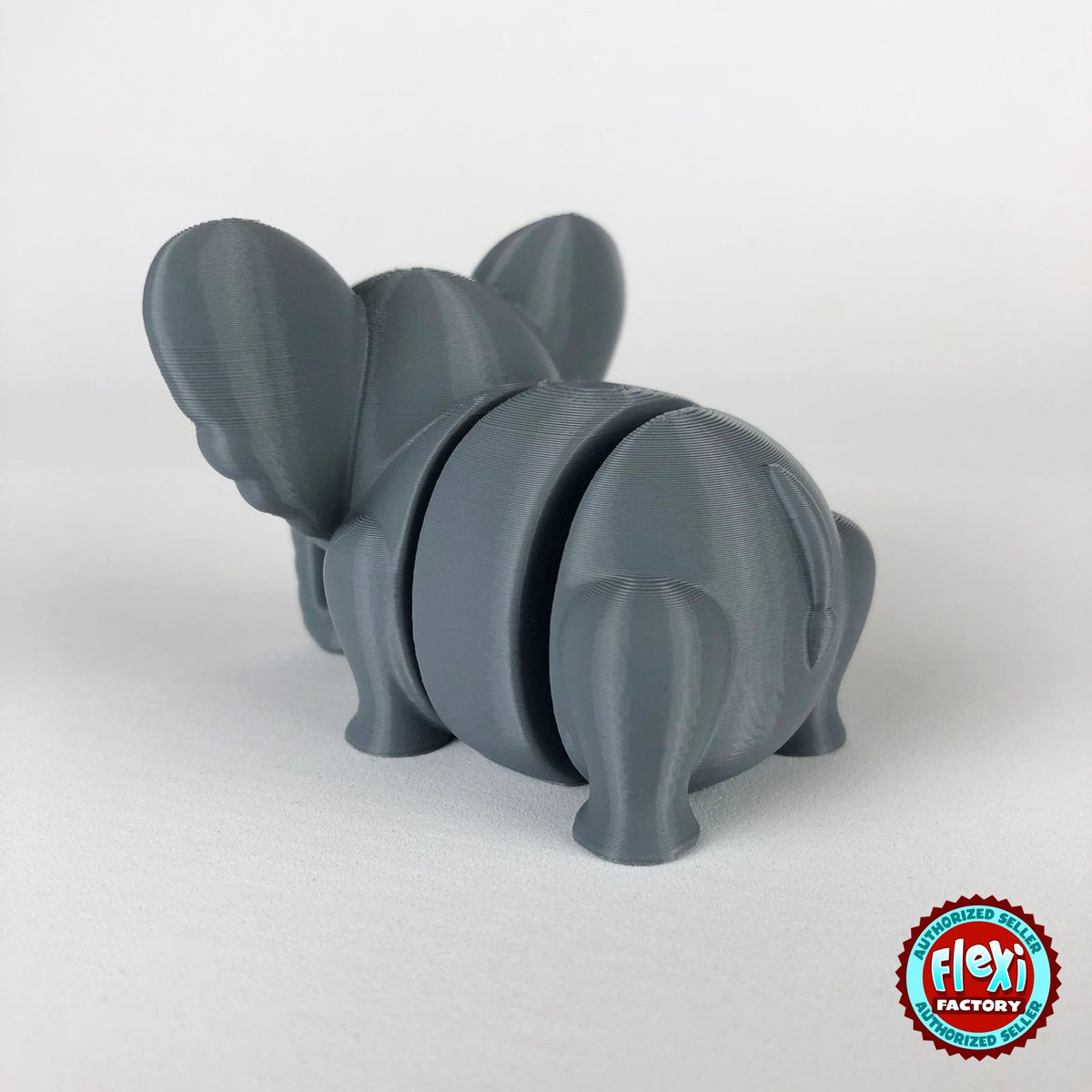 Cute elephant keychain, 3D printed by RU3D – dark eyes rear three quarter view. Grey.