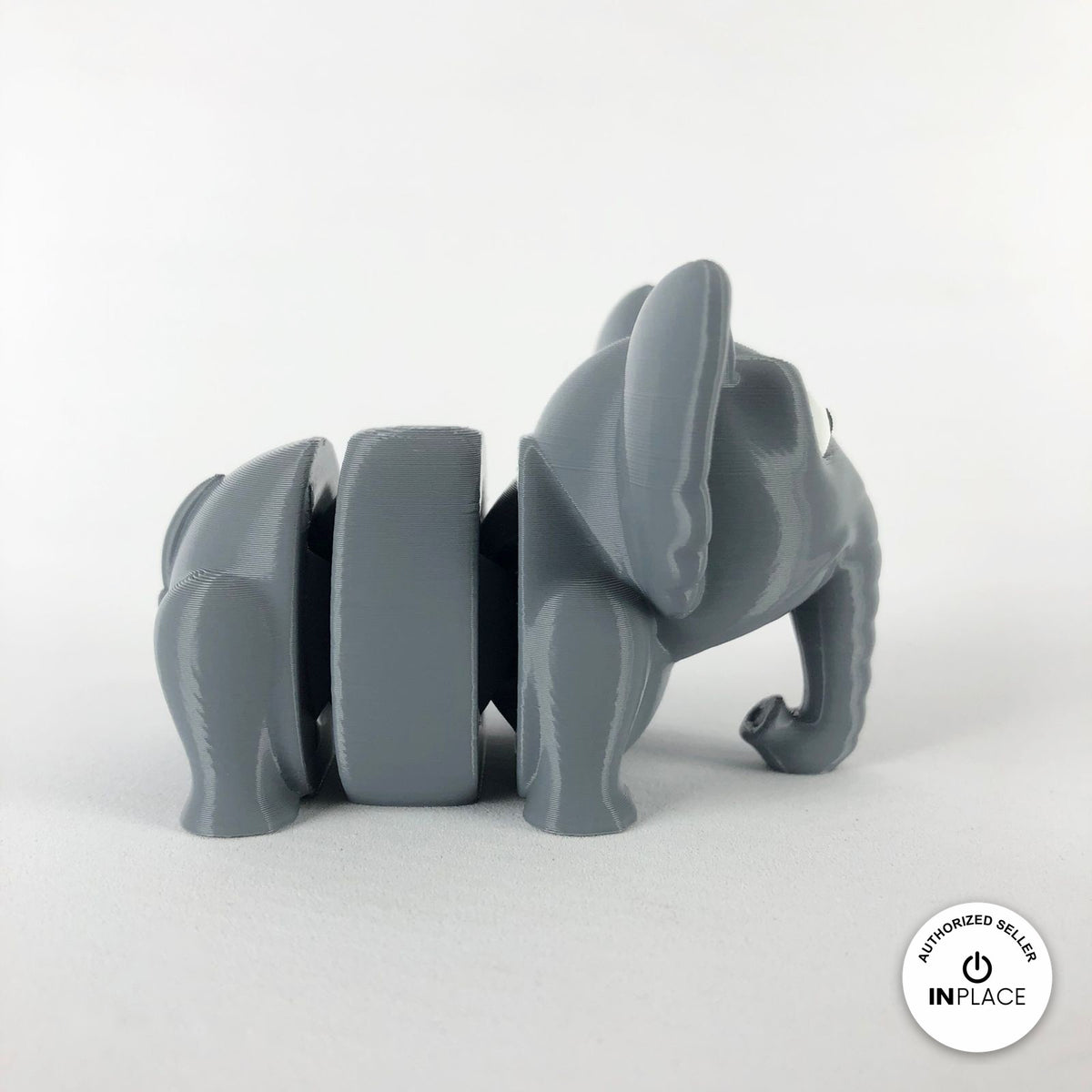 Cute elephant keychain, 3D printed by RU3D – side view facing right. Grey.