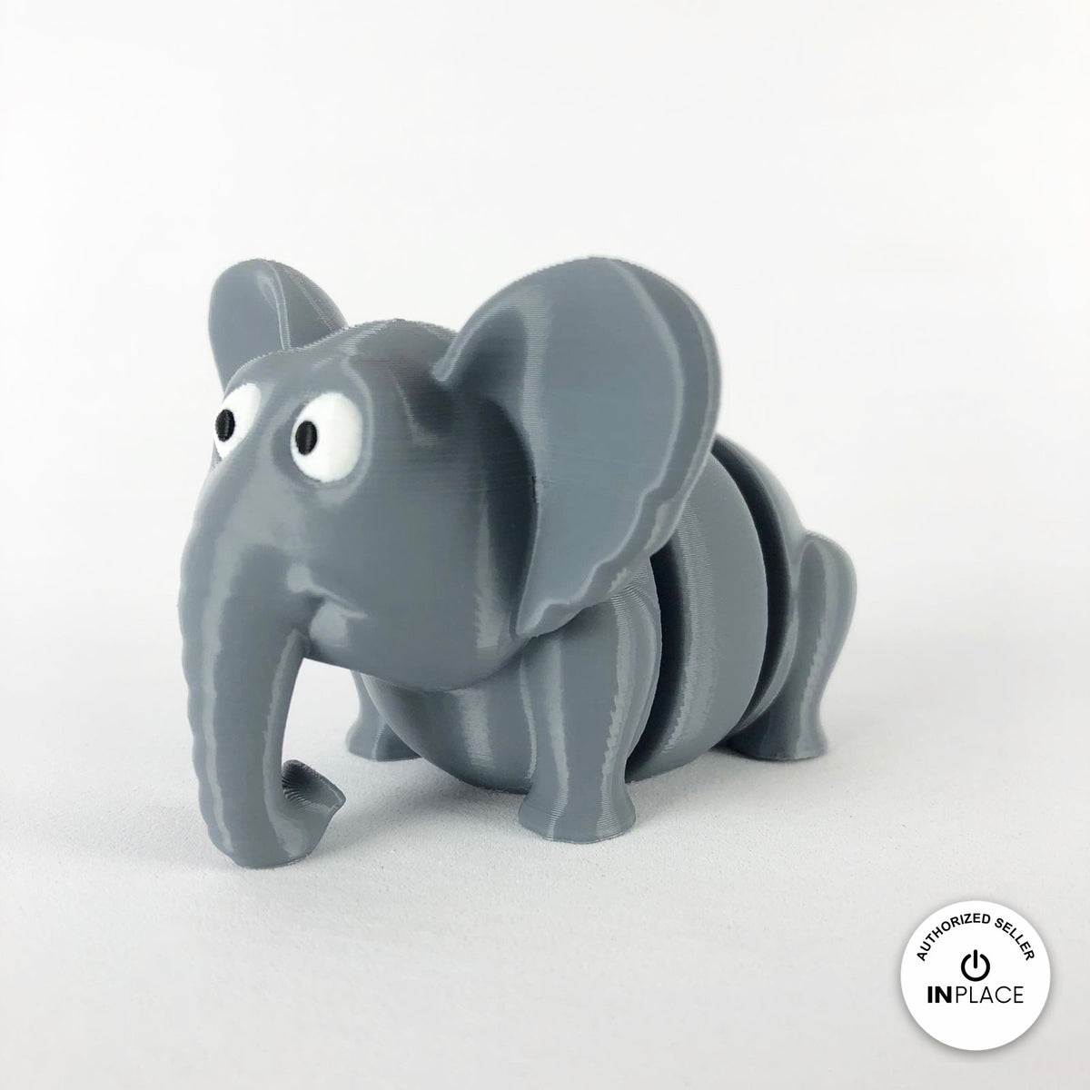 Cute elephant keychain, 3D printed by RU3D – three quarter view facing left. Grey.