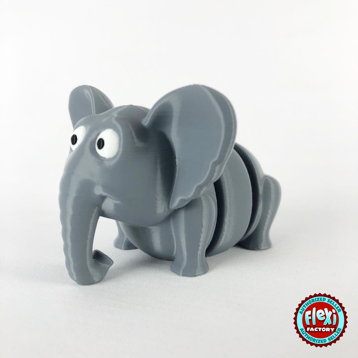 Cute elephant keychain, 3D printed by RU3D – three quarter view facing left. Grey.