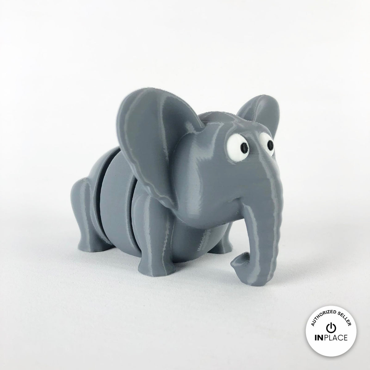 Cute elephant keychain, 3D printed by RU3D – three quarter view facing right. Grey.