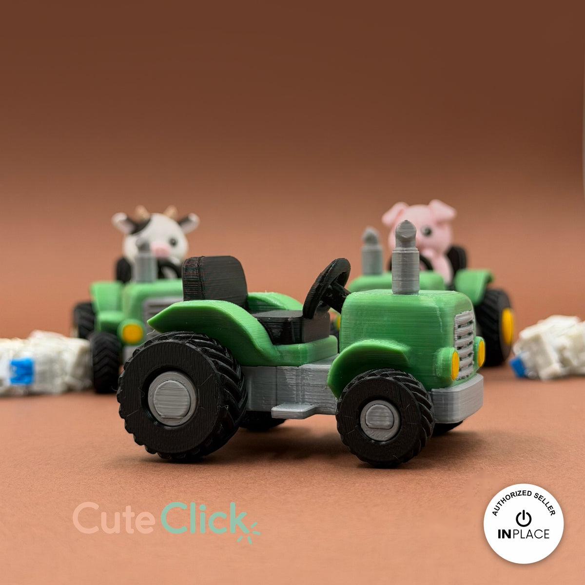 Cute farm tractor keychain, 3D printed by RU3D – three quarter view with farm friends. Green and grey with cow and pig drivers.