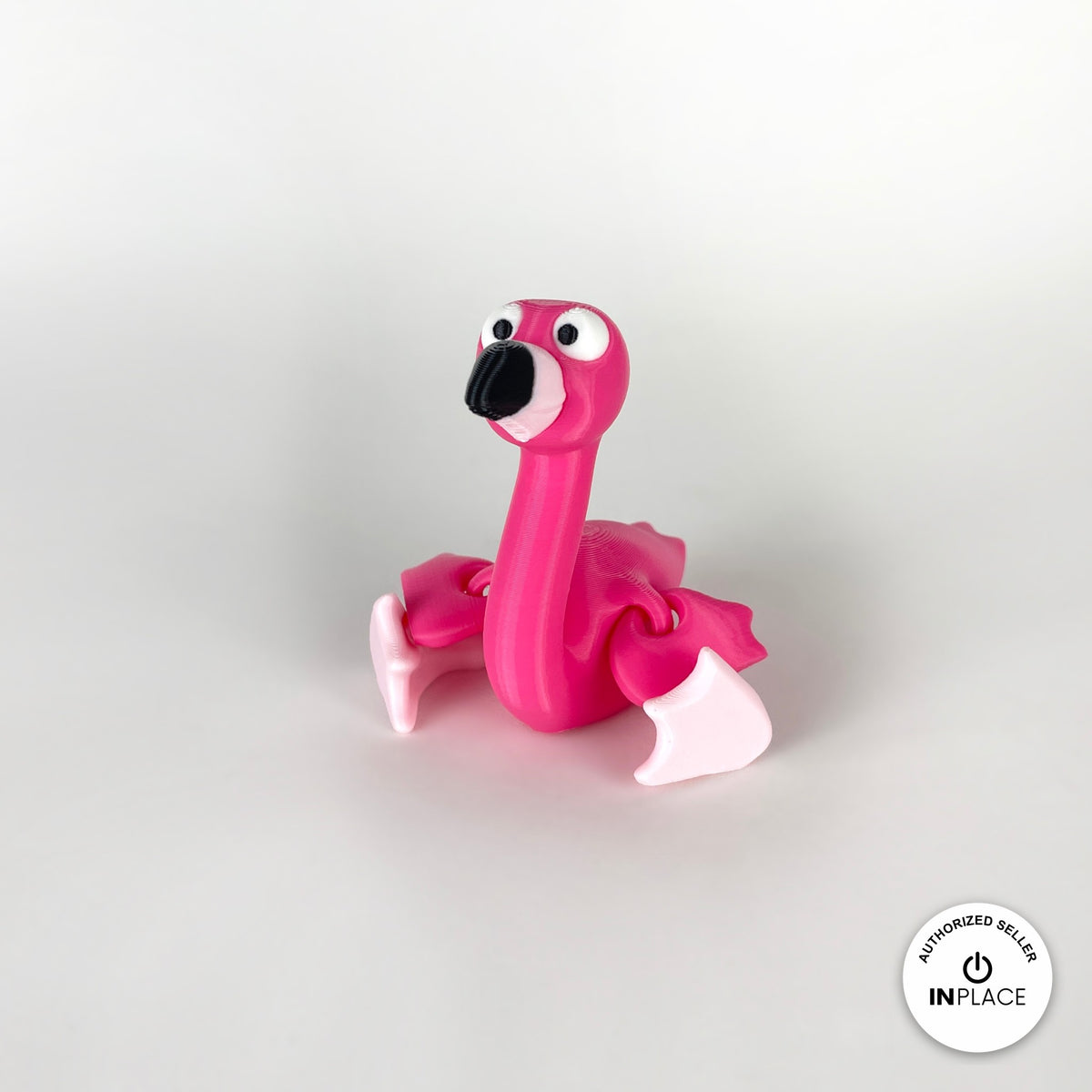 Cute flamingo keychain, 3D printed by RU3D – sitting front view. Hot pink, also in light pink.