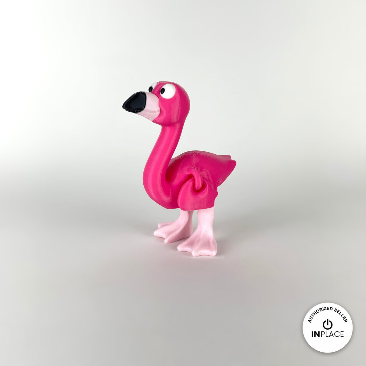 Cute flamingo keychain, 3D printed by RU3D – standing three quarter view facing left. Hot pink, also in light pink.
