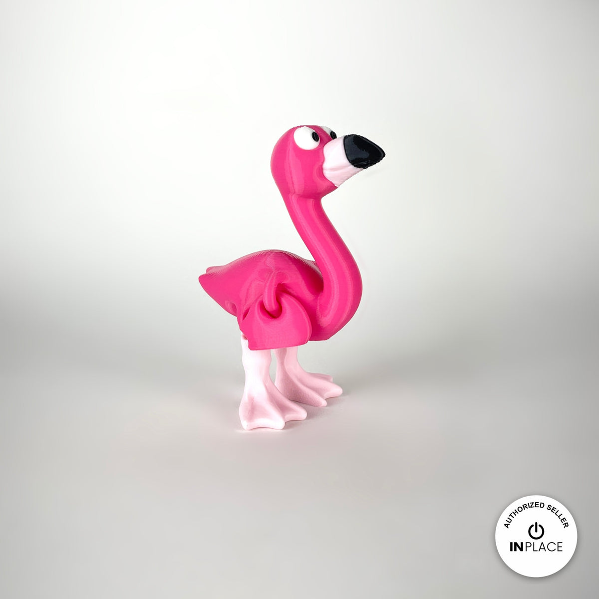 Cute flamingo keychain, 3D printed by RU3D – standing three quarter view facing right. Hot pink, also in light pink.