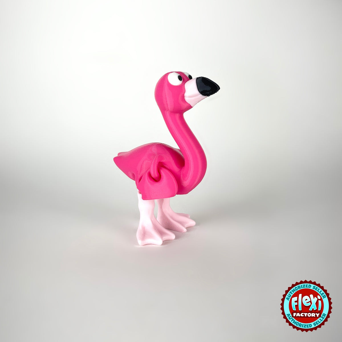 Cute flamingo keychain, 3D printed by RU3D – standing three quarter view facing right. Hot pink, also in light pink.