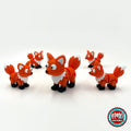 Cute fox keychain, 3D printed by RU3D – group of foxes. Orange with white chest and tail tip.